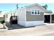 Mobile home with carport and small yard at 701 S Dobson Rd # 158, Mesa, AZ 85202