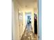Long hallway with wood-look floors, leading to kitchen at 701 S Dobson Rd # 158, Mesa, AZ 85202