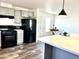 Modern kitchen with gray cabinets, island, and stainless steel appliances at 701 S Dobson Rd # 158, Mesa, AZ 85202