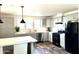 Modern kitchen with gray cabinets, island, and stainless steel appliances at 701 S Dobson Rd # 158, Mesa, AZ 85202