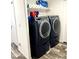 Laundry room with washer, dryer, and shelving at 701 S Dobson Rd # 158, Mesa, AZ 85202