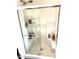 Walk-in shower with glass enclosure and built-in shelving at 701 S Dobson Rd # 158, Mesa, AZ 85202