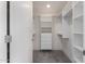 Spacious walk-in closet with shelves and hanging rods at 7127 E Rancho Vista Dr # 6003, Scottsdale, AZ 85251