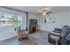 Cozy living room with hardwood floors and large window at 9307 W Glen Oaks Cir, Sun City, AZ 85351