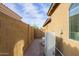 Side yard with AC units and a paved walkway at 9412 S 181St Ave, Goodyear, AZ 85338