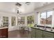 Eat-in kitchen with light green cabinets, stainless steel appliances, and a breakfast nook at 1179 N 87Th St, Scottsdale, AZ 85257