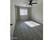 Spacious bedroom with wood-look floors and large window at 1219 N 47Th Pl, Phoenix, AZ 85008