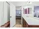 Bathroom with a vanity, toilet, and shower; view of bedroom at 17297 N Cosa St, Maricopa, AZ 85138