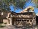 View of home's exterior, showcasing a two-car garage and landscaping at 25150 N Windy Walk Dr # 39, Scottsdale, AZ 85255