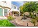 Spacious backyard patio with fountain and seating area, perfect for outdoor entertaining at 3440 N Boulder Ct, Buckeye, AZ 85396