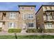 Three-story townhome with stone exterior and landscaped front yard at 3683 E Leslie Dr, Gilbert, AZ 85296