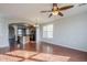 Open concept living room with kitchen view and hardwood floors at 3683 E Leslie Dr, Gilbert, AZ 85296