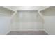 Large walk-in closet with double hanging rods at 4155 S 243Rd Dr, Buckeye, AZ 85326