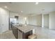 Kitchen island with granite countertops and stainless steel appliances at 4155 S 243Rd Dr, Buckeye, AZ 85326