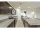 Modern kitchen with stainless steel appliances and granite countertops at 4155 S 243Rd Dr, Buckeye, AZ 85326