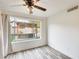 Bedroom with large window and view of backyard pergola at 6138 W Park View Ln, Glendale, AZ 85310