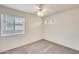 Bright bedroom with ceiling fan and window at 6138 W Park View Ln, Glendale, AZ 85310