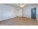 Spacious bedroom with tile flooring and access to bathroom at 6819 E Grandview Dr, Scottsdale, AZ 85254