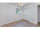 Well-lit bedroom featuring tile floors and built-in closet at 6819 E Grandview Dr, Scottsdale, AZ 85254