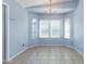 Charming dining area with bay window and tile flooring at 6819 E Grandview Dr, Scottsdale, AZ 85254
