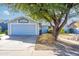 Light blue home with mature tree and walkway at 6819 E Grandview Dr, Scottsdale, AZ 85254