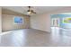 Open living area with tile floors and access to patio at 6819 E Grandview Dr, Scottsdale, AZ 85254