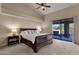 Primary bedroom with sliding glass doors to patio at 9325 E Paraiso Dr, Scottsdale, AZ 85255