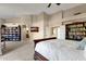 Spacious main bedroom with built-in shelves and ensuite bathroom at 9325 E Paraiso Dr, Scottsdale, AZ 85255