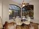 Bright breakfast nook with table and four chairs, adjacent to kitchen at 9325 E Paraiso Dr, Scottsdale, AZ 85255