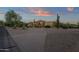 Stunning home exterior with a brick driveway and desert landscape at 9325 E Paraiso Dr, Scottsdale, AZ 85255