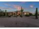 Beautiful home with desert landscaping and a paved driveway at 9325 E Paraiso Dr, Scottsdale, AZ 85255