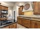 Kitchen features granite countertops and ample wood cabinetry at 9325 E Paraiso Dr, Scottsdale, AZ 85255