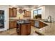 Gourmet kitchen with island, granite counters, and stainless steel appliances at 9325 E Paraiso Dr, Scottsdale, AZ 85255