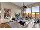 Relaxing living room with large sectional sofa and plenty of natural light at 9325 E Paraiso Dr, Scottsdale, AZ 85255