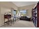 Home office with built-in bookcase and window seat at 9325 E Paraiso Dr, Scottsdale, AZ 85255