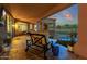 Covered patio with comfortable seating overlooking the pool and backyard at 9325 E Paraiso Dr, Scottsdale, AZ 85255