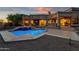 Stunning backyard oasis featuring a sparkling pool and patio area at 9325 E Paraiso Dr, Scottsdale, AZ 85255