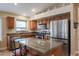 Well-equipped kitchen featuring granite countertops and wood cabinets at 16204 W Hilton Ave, Goodyear, AZ 85338