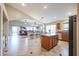 Spacious kitchen with an island, granite countertops, and stainless steel appliances at 16204 W Hilton Ave, Goodyear, AZ 85338