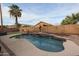 Inviting kidney shaped pool with waterfall feature at 16204 W Hilton Ave, Goodyear, AZ 85338