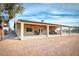 Home's exterior with covered patio and landscaping at 20247 E Happy Rd, Queen Creek, AZ 85142