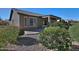Landscaped backyard with patio and desert landscaping at 7132 W Trenton Way, Florence, AZ 85132