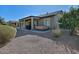 Covered patio with hot tub and grill, overlooking a gravel backyard at 7132 W Trenton Way, Florence, AZ 85132