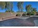 Backyard with a brick pathway and desert landscaping at 7132 W Trenton Way, Florence, AZ 85132