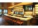Community bar with seating and large TV at 7132 W Trenton Way, Florence, AZ 85132