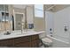 Clean bathroom with a shower/tub combo and updated vanity at 7132 W Trenton Way, Florence, AZ 85132