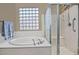 Bathroom features a large shower and a soaking tub at 7132 W Trenton Way, Florence, AZ 85132