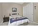 Charming bedroom with a double door closet and nightstand at 7132 W Trenton Way, Florence, AZ 85132