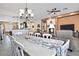 Open dining room with seating for eight and access to the kitchen at 7132 W Trenton Way, Florence, AZ 85132