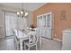 Elegant dining room with a large table and white hutch at 7132 W Trenton Way, Florence, AZ 85132